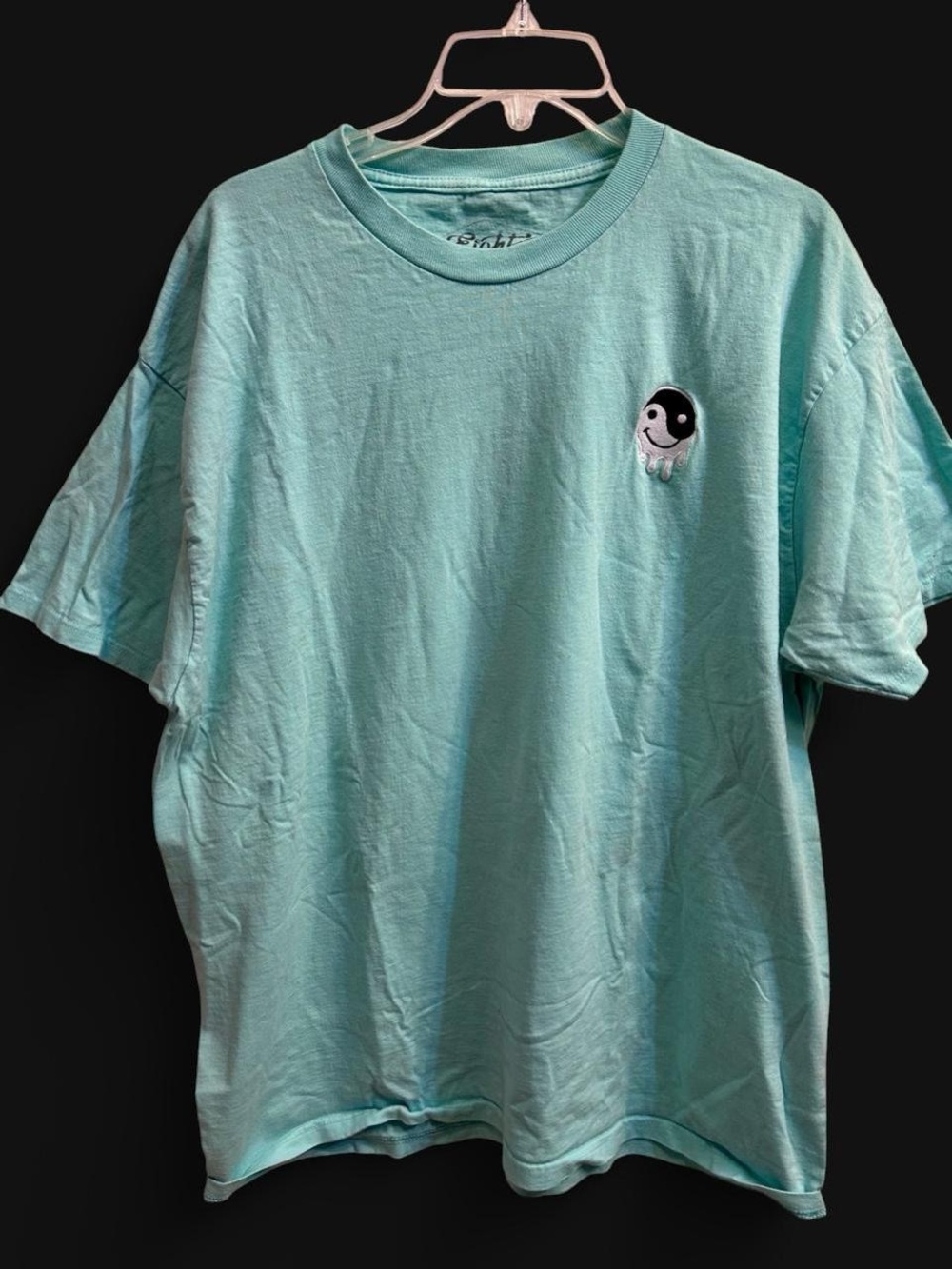 Teal cotton t-shirt with drippy yin yang graphic